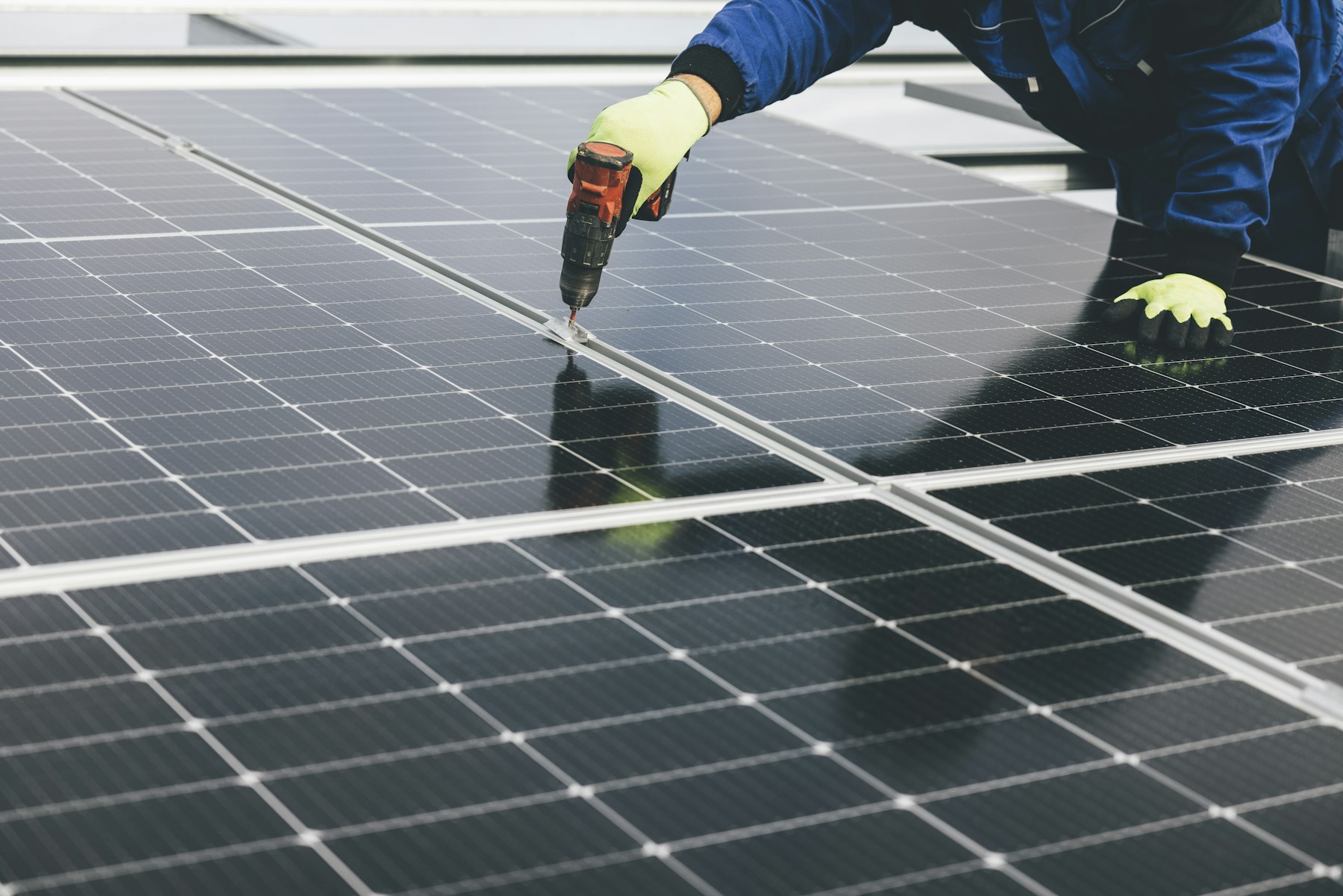 Vivan technician working on solar panels